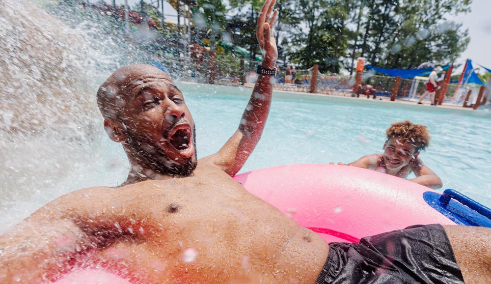 dad-and-son-in-pool Go Again with A Season Pass