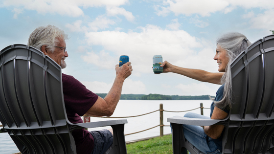 Couple relaxing in the campground by the lake