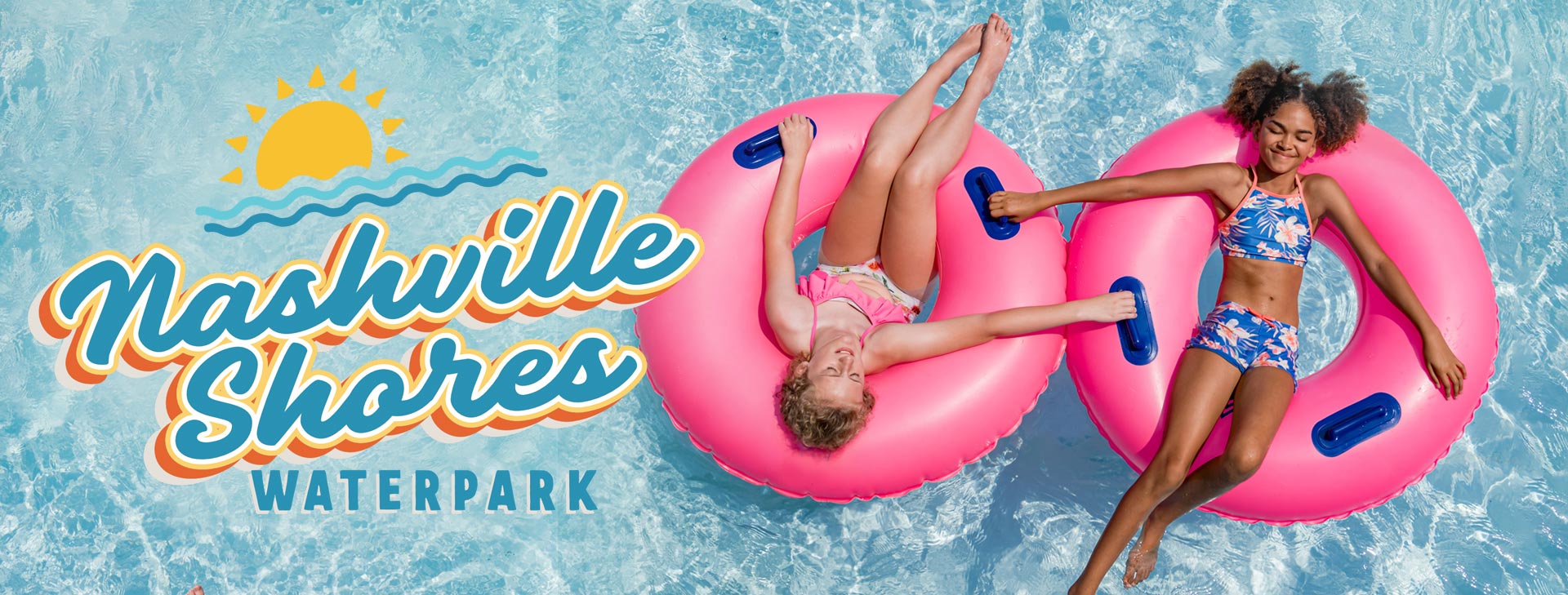 Two girls floating on tubes in a pool at Nashville Shores Waterpark