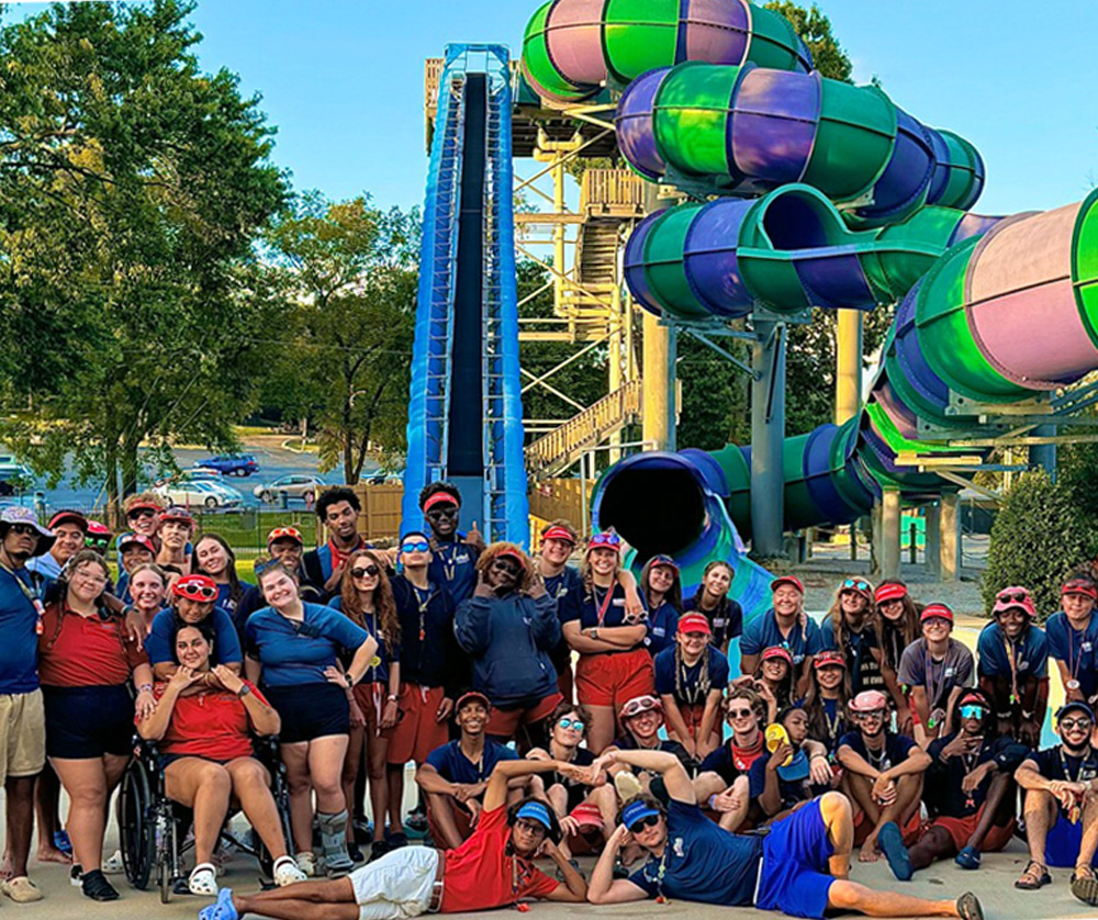 team-member-photo-of-employees Team member photo of group of employees by water slide